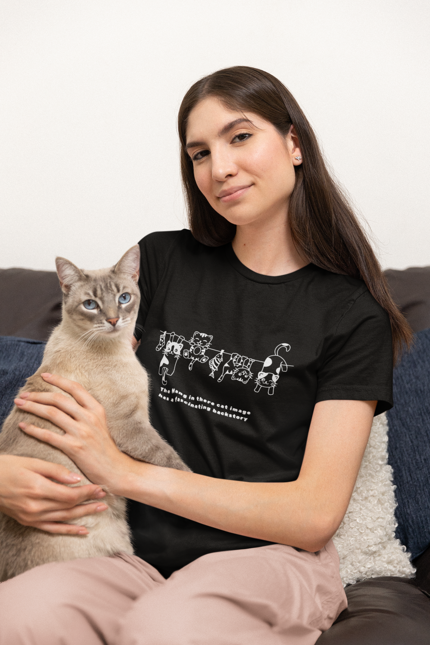 The Hang in There image has a fascinating backstory, cat T-shirt.